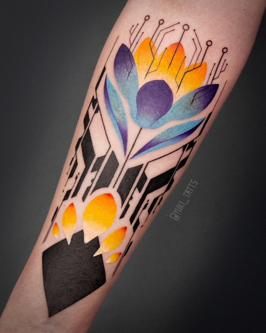 Vibrant cyberpunk tattoo on forearm featuring a stylized flower with circuit-like elements in blue, purple, and orange hues
